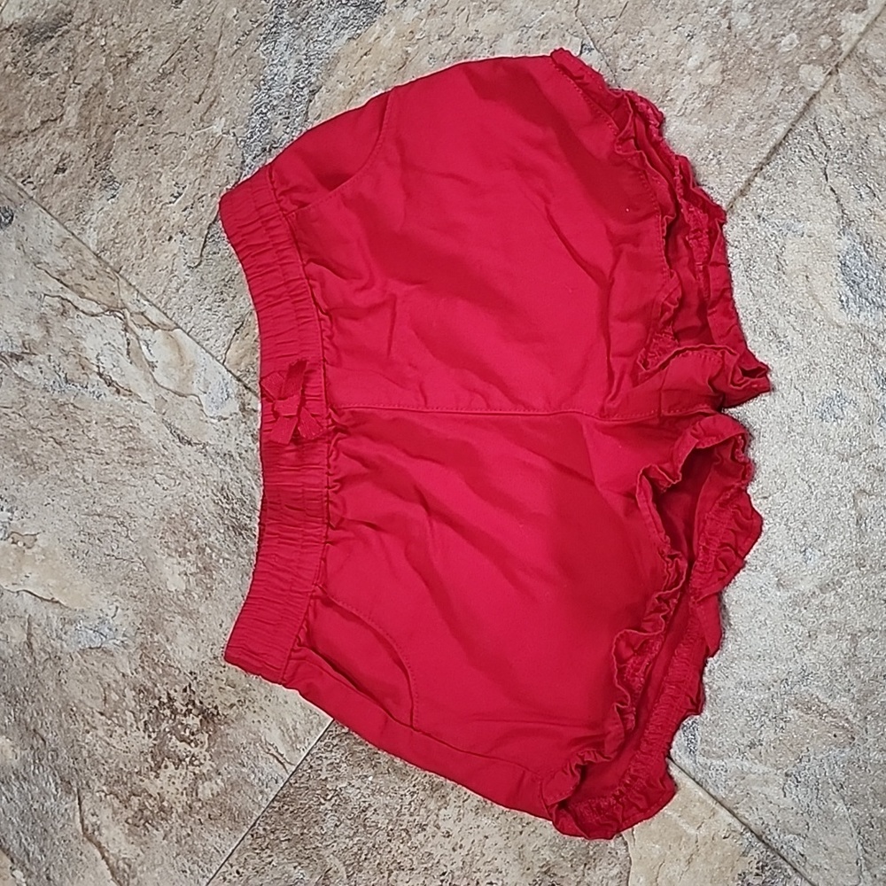 Red cotton shorts with ruffle trim